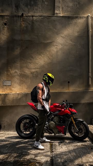 Jasper with a red motorbike