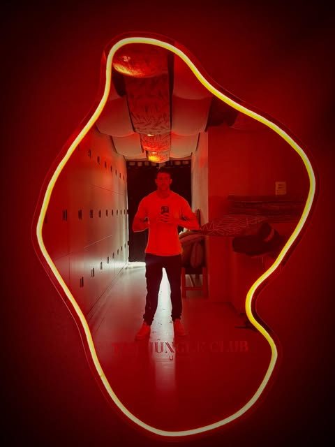 Jasper framed by red neon light